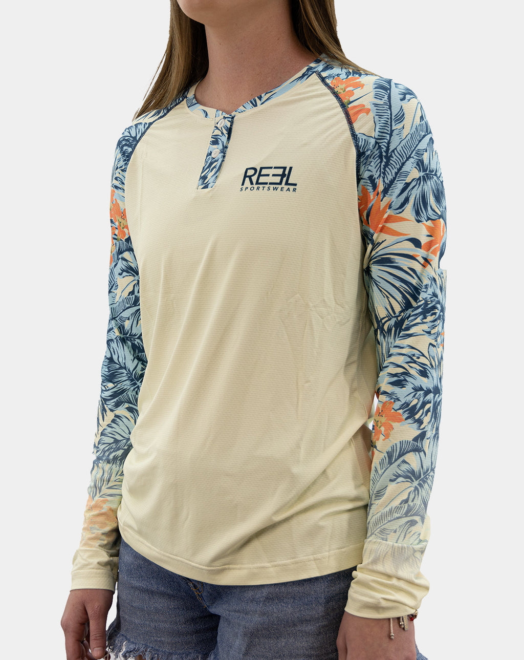 Three-quarter front view of women’s Erin Henley fishing shirt in blue and orange tropical print